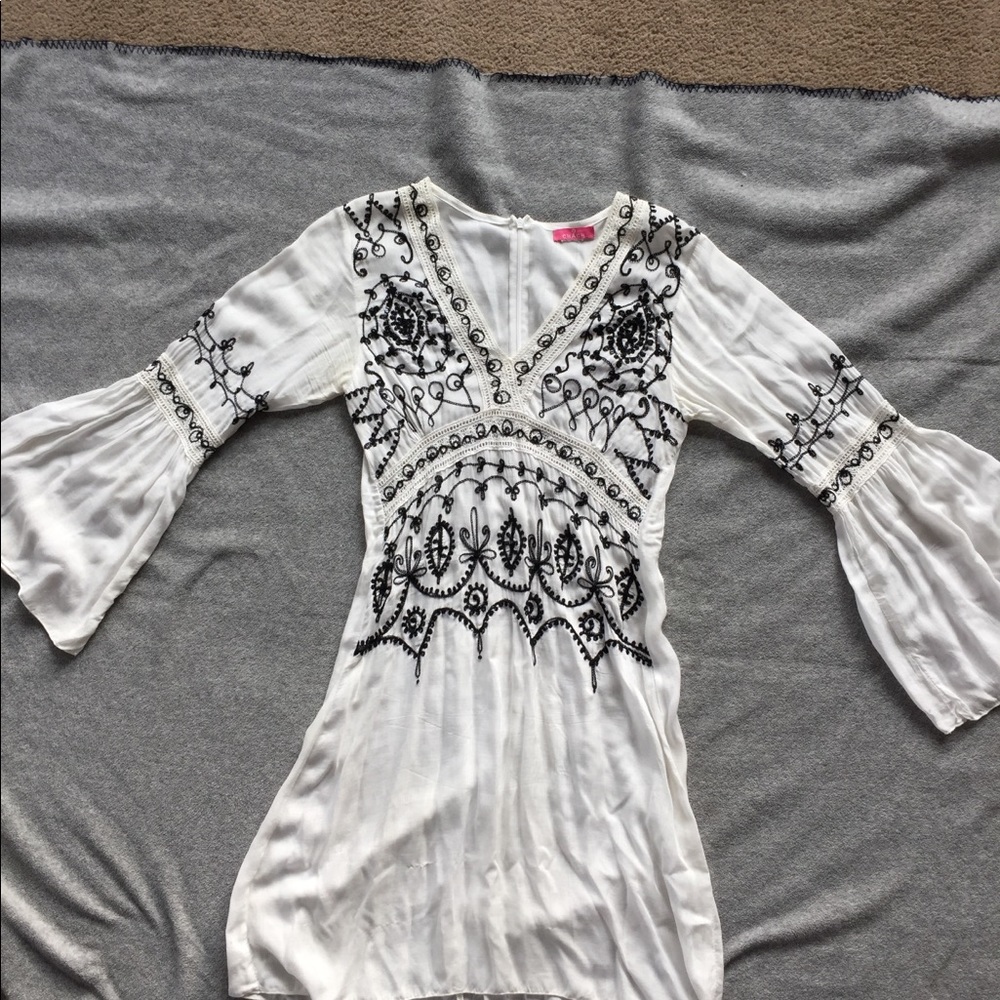White beach coverup with black embroidery